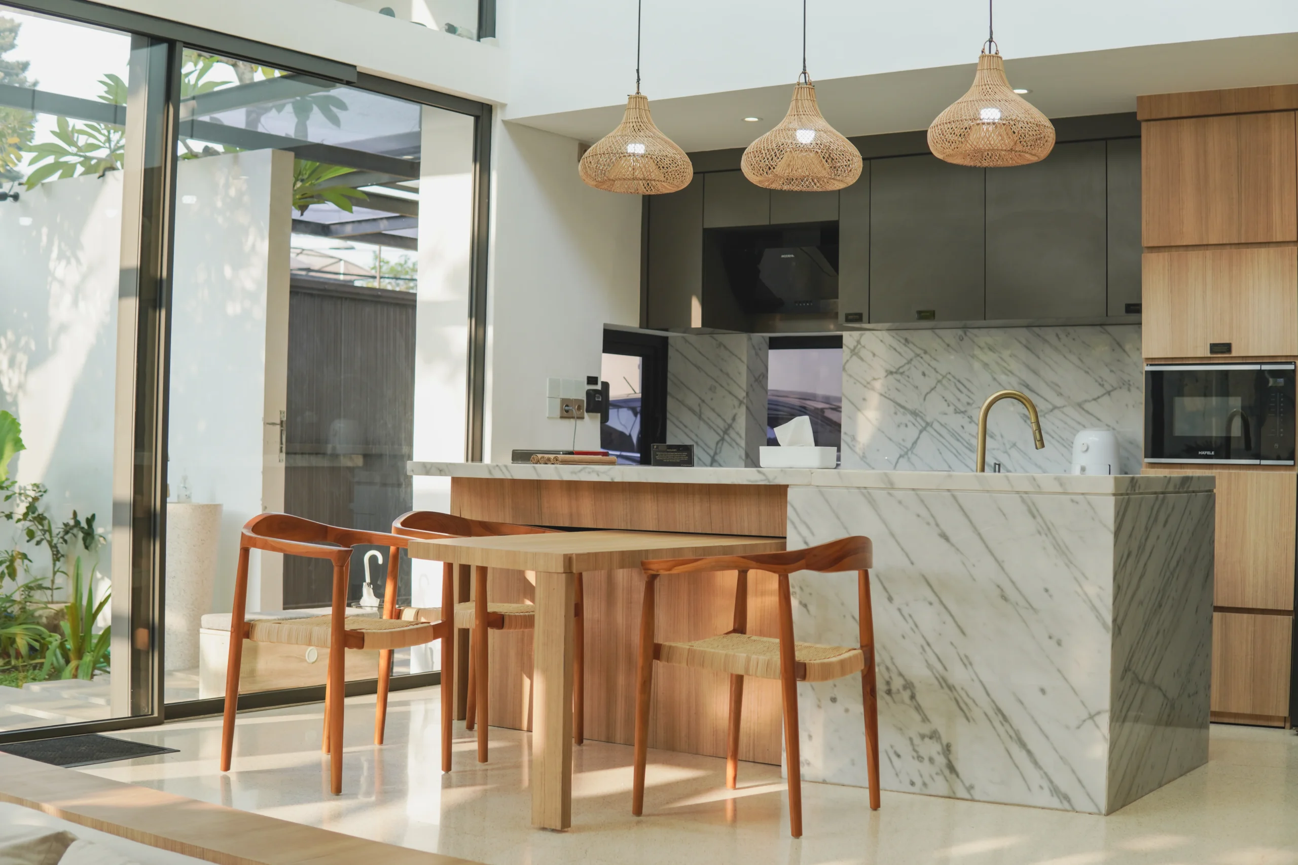 a-kitchen-with-a-marble-countertop-and-large-islan-2026-01-06-10-21-51-utc