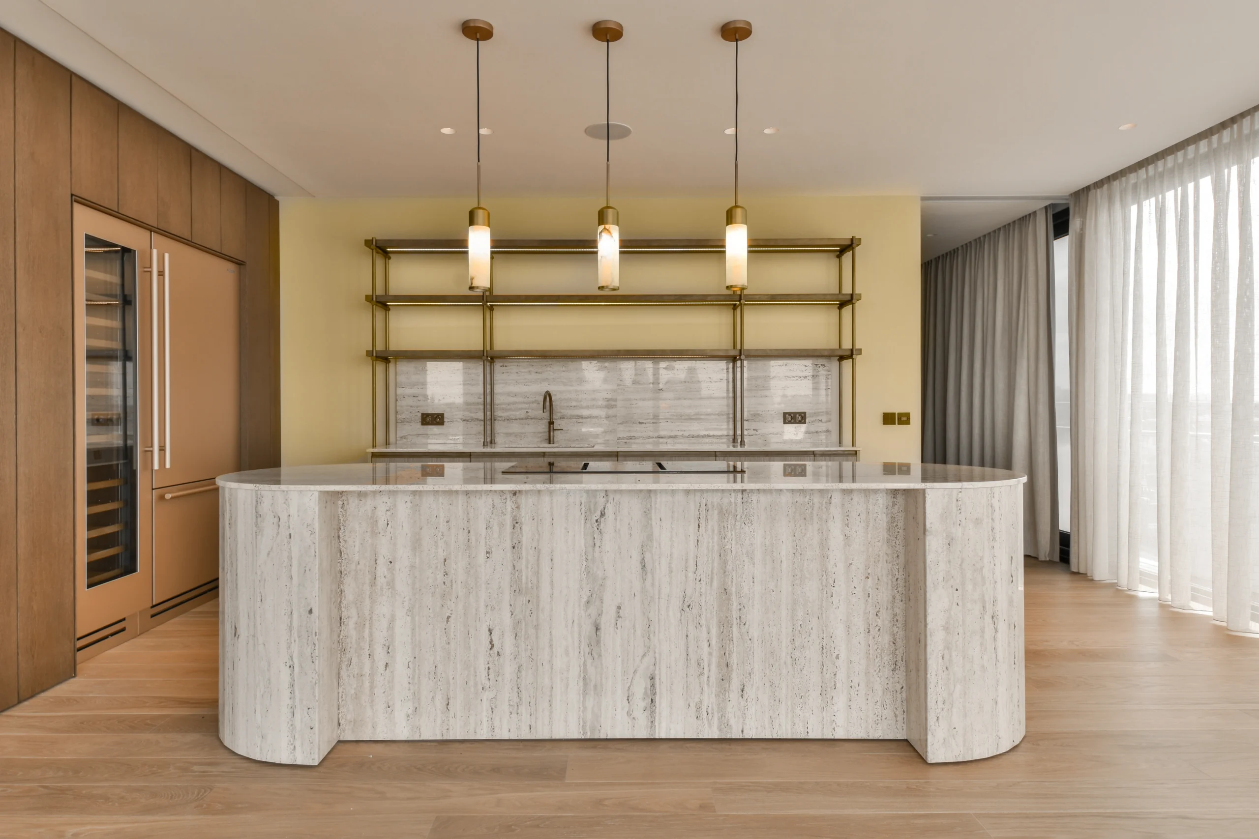 a-large-kitchen-with-a-white-island-and-wood-floor-2026-01-07-23-39-50-utc